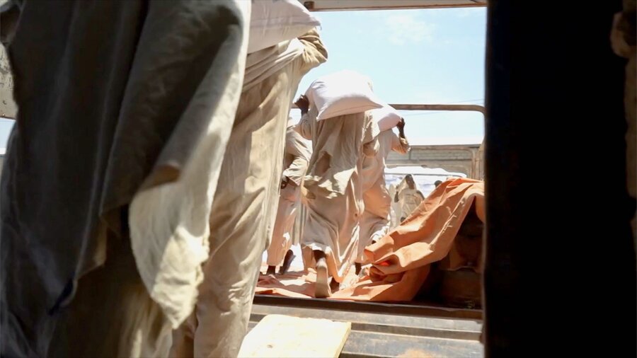 WFP food assistance being loaded on to trucks in Port Sudan bound for hunger hotspots elsewhere in the country. Photo: WFP/Abubakar Garelnebei